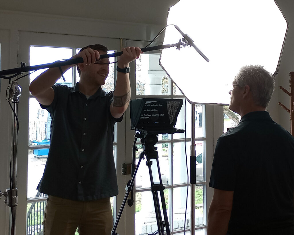 andrew setting up to film commercial bts